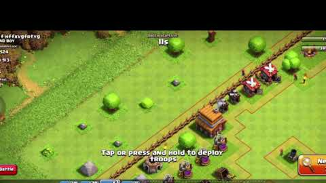 Playing clash of clans doing a attack in a village