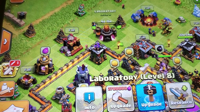 Clash of clans. Using hammer of building on laboratory while research in progress.